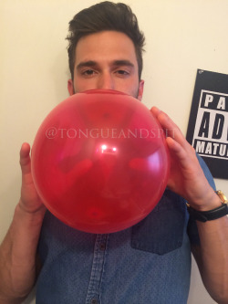 My friend Adam Rainman blowing a balloon.