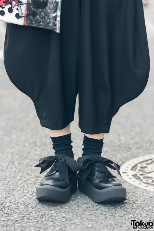 Japanese designer Shiho Tabei on the street in Harajuku wearing all black fashion by Comme Des Garco