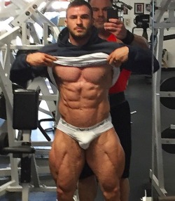 musclegodselfies:  Dennis Reinhold proudly showing off for Coach…