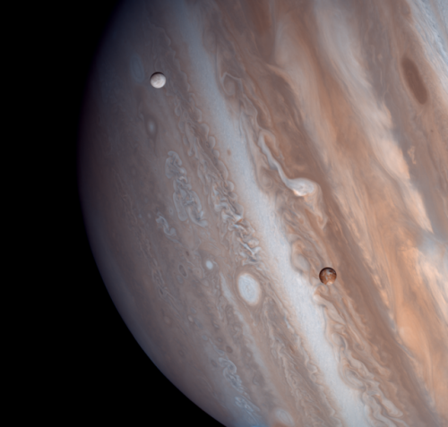astronomyblog:Io and Europa taken by the Voyager 1 spacecraft in 1979Image credit: Justin Cowart