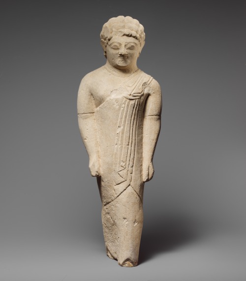 Statuette (limestone) of a beardless male votary in Greek dress. Artist unknown; late 6th cent. BCE.