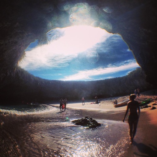 atlasobscura:  Hidden Beach - Mexico A gaping hole in the surface of the lush green island exposes a secret beach, with ample shade, sun and crystal-clear water. The Marieta Islands are an archipelago, a chain of islands that exist as a result of volcanic