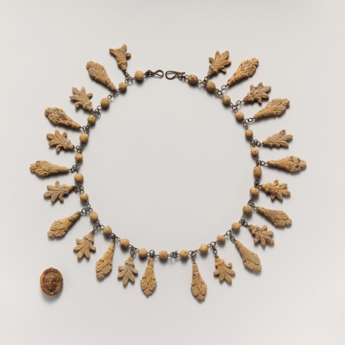 Necklace with palmette and lotus pendants. 3rd c. B.C.; terracotta. The Metropolitan Museum of Art. 