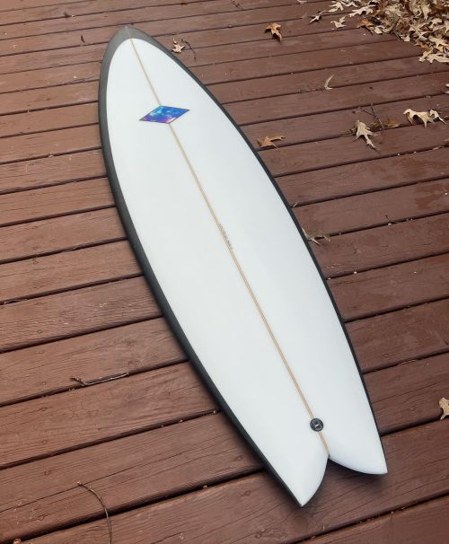 Been working on some personals this winter to keep the stoke alive. This 5’11” Quad is a shrunken down version of a 6’3” twin I have been rocking! Looks forward to some proper test next swell. #garbuttsurfboards...