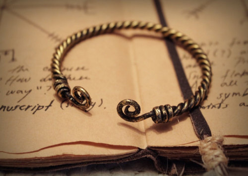 Custom handmade viking torc bracelet. The bracelet is handwoven from hardened aluminium wire and fin