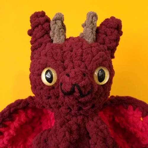 Dark red dragon with gold eyes. These large dragons are made with soft and squishy blanket yarn. Thi