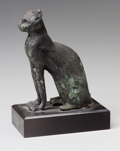 Ancient Egyptian cats2. bronze figurine of a cat attached to black wooden base, 760 BCE-364 CE