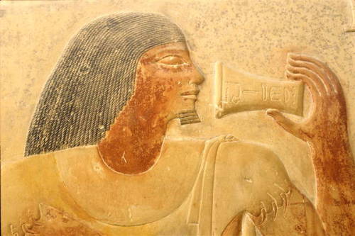 Ptahhotep in leopard skin, raising a goblet to his lips, detail of a wall carving from the Mastaba o