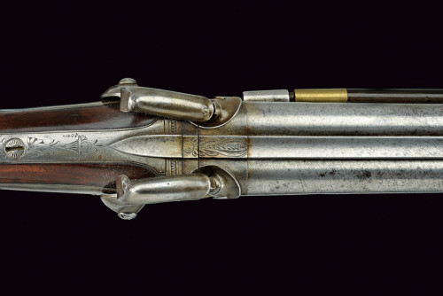 A four barreled percussion shotgun originating from France, mid 19th century.