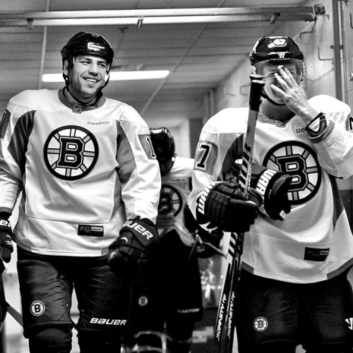 nhlbruins:  Torey Krug jokingly shields himself from the camera with Milan Lucic as he walks from th
