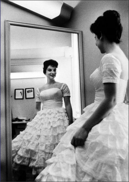 High School girl trying on a prom dress, 1958Al Fenn