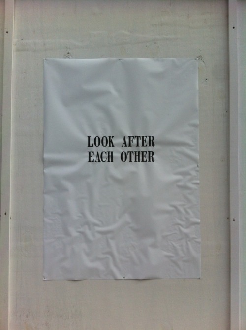 [Two photos each of a sheet of printer paper apparently glued to the wall. The first one reads: &ldq