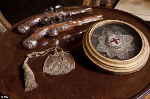 A set of flintlock pistols, garter star, and chainmail purse belonging to John Churchill, 1st Duke o