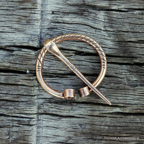 irisharchaeology:    This small bronze cloak-pin is inspired by penannular brooches found in Ireland during the early medieval period (c. 400-1100 AD). The terminals of the brooch are curled, while the body bears incised decoration.   The pin is available