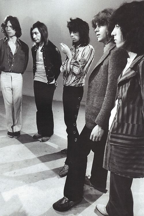 weirdpicturesoftherollingstones:  they look like schoolboys doing a group presentation  Mick: knows the presentation by heart and actually enjoys the attention but is a little anxious because he wants a top grade Charlie: absolutely fucking hates to stand