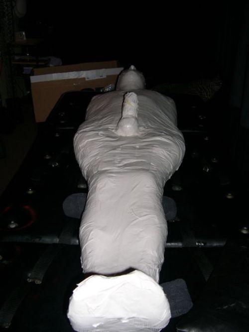 chillgguy:  Great mummification scene - white tape over vet wrap - and a plug gag in my mouth. Was immobilized overnight - very, very hot! 