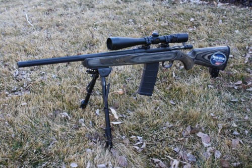 gunrunnerhell:  Mossberg MVP Predator A bolt-action rifle that takes AR-15 magazines (and drums), the MVP Predator has a wooden stock and 18” fluted barrel. The trigger is similar to the Savage Accu-Trigger and is adjustable. Although it uses AR-15