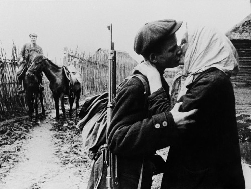 gunsandposes:“Kolkhoz farmer M. Nikolaïeva bids her son Ivan goodbye before he joins the partisans.”