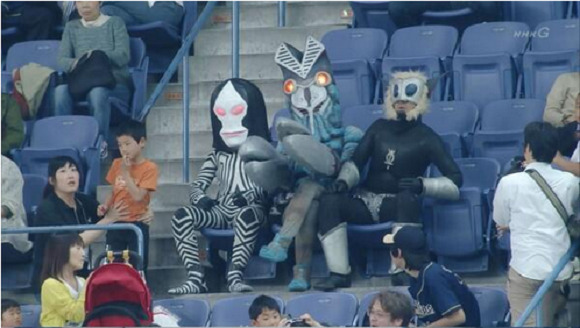 astoundingbeyondbelief:  Ultraman villains getting thrown out of a baseball game.