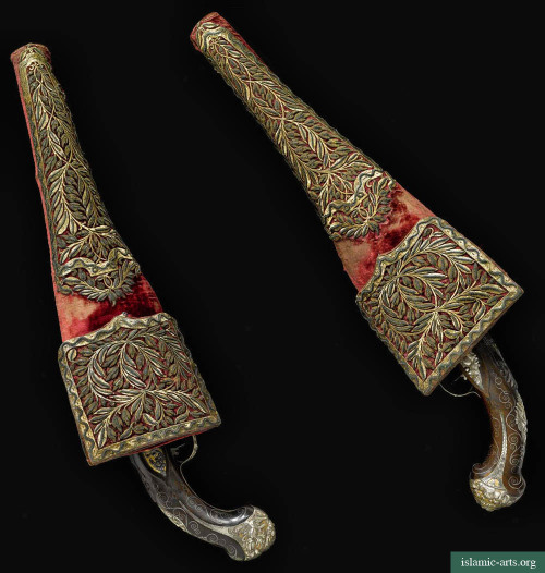 Pair of 19th century Ottoman Turk pistols with embroidered saddle holsters.