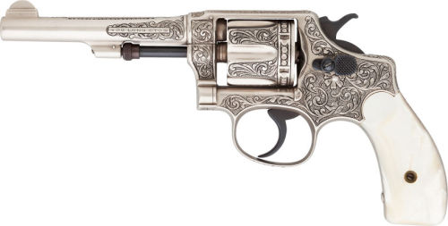 Custom engraved Smith and Wesson revolver with pearl grips. 