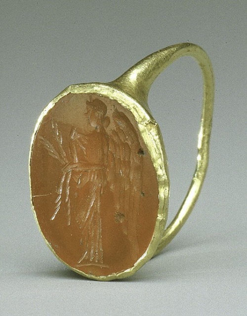 rosebiar: Visit metmuseum.org ~ Gold ring with carnelian intaglio: winged Nemesis. Imperial Period. 