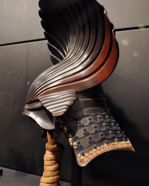 A Japanese Samurai Helmet (Harikake kabuto) with elaborate decoration on an iron helm. Early Edo Per