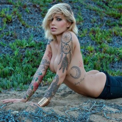 thatattoozone:    Tina Louise  phototaker