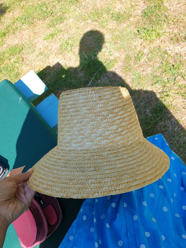 the sunhat without decorations or labels ready to be transformed. the shape is a bit uneven.