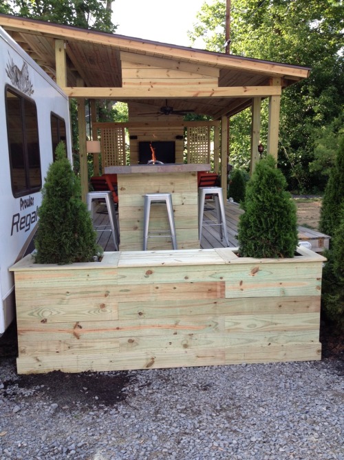 craftycub:  I’ve been helping Mike add on to his deck at the camper. The Deck was already there, but the two of us added the roof, and television wall, built the fire pit table and planter. Can’t wait to use it! :)