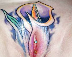 VCH piercing with a pussy framing tattoo