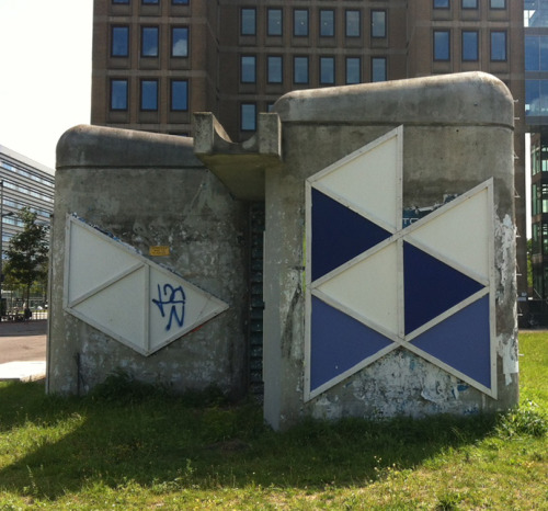Beautiful concrete structure mercilessly defaced with coloured plates, Amsterdam-Oost