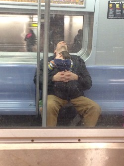 jsantagato:  Took this picture of a guy sleeping with his kid sleeping on his chest