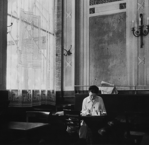 the-night-picture-collector:Robert Doisneau, Simone de Beauvoir at the Deux Magots, Paris, 1944