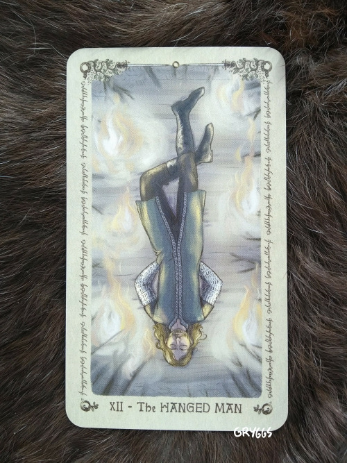 Lord of the Rings Tarot: XII - The Hanged Man: Faramir[ID: a photo of a digitally painted tarot card