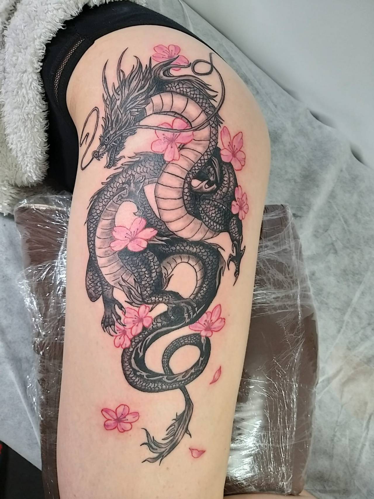 Dragon and cherry blossom art artist artistic tattooarist 9 9dragons  9dragonsin  Dragon tattoo designs Dragon tattoo with flowers Dragon  tattoo for women