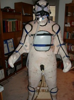 sparkypupdd:  lawcub605:  whipman-andy:  The “sarcophagus”The object (fully dressed in heavy rubber) is fixed into this rigid corpus, breathing-, feeding- &amp; relief tubes are installed and afterwards it can be left in this for an undifined time….