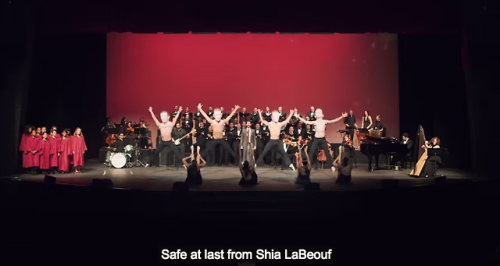 dxstihell:  nowwheresmynut:  schmoyoho:  In which a children’s choir, grown-up choir, orchestra, dancing paper-mache-head Shia LaBeoufs, and aerialists perform a song about Shia LaBeouf’s gruesome cannibalistic nature TO SHIA LABEOUF. Thank goodness