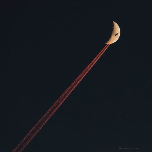 Plane Crossing a Crescent Moon : No, this is not a good way to get to the Moon. What is pictured is