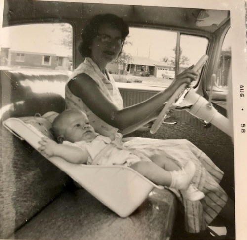 Car seat safety in 1958. Not strapped in to anything, these seats relied on the mother to put her ar