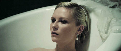 michaelsbjordans:I smile, and I smile, and I smile.Melancholia (2011), dir. Lars von Trier