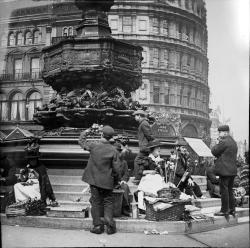 vintageeveryday:  Flower sellers by the Eros Statue, Piccadilly Circus, London. ca. 1900s. 