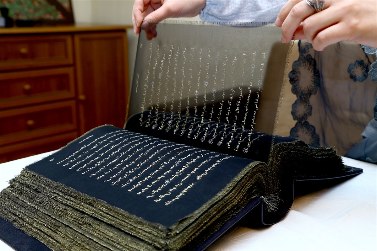 qmr:  Azerbaijani painter writes Quran on transparent silk pages Azerbaijani painter