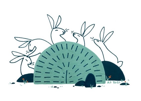 Five rabbits conspire behind a bush. 