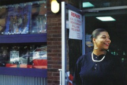 nerd&ndash;vana:  Queen Latifah in front of a shop displaying her poster in the window. 