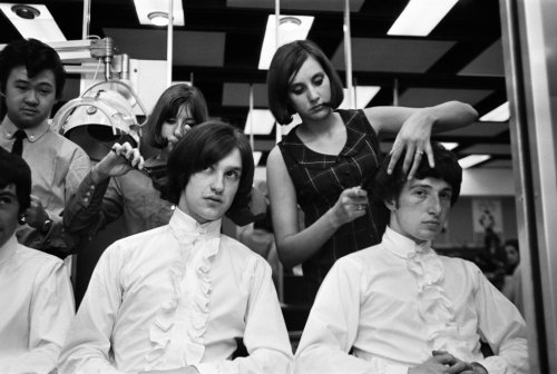 Pete Quaife and Dave Davies (Mick Avory to the left and Ray not pictured) having their hair styled, 