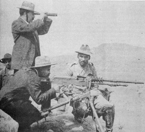 Pancho Villa firing a French Hotchkiss Mle. 1914 machine gun, Mexican Revolution.