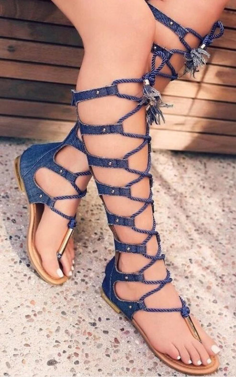 Very unique lace up thong sandals on pretty feet.