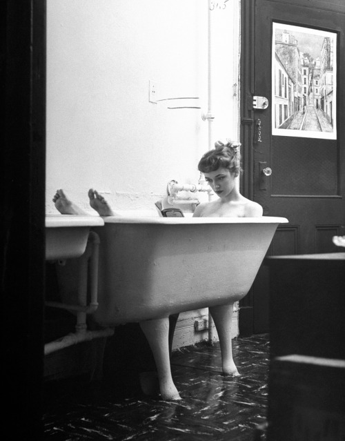 In Tiny Tub Which Is In The Kitchen, Jo Ann Reads A Paperback While Bathing. Apartment Does Not Have