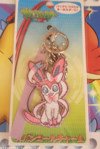 eeeee look what i snagged today, this is a sequin charm, it’s made out of really shimmery thread, there’s a line of them with some other pokemon but of course i needed sylveon <3 im happy i got one cause they’re pretty rare now 